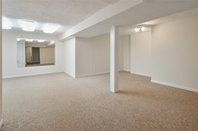 basement with a textured ceiling and light carpet