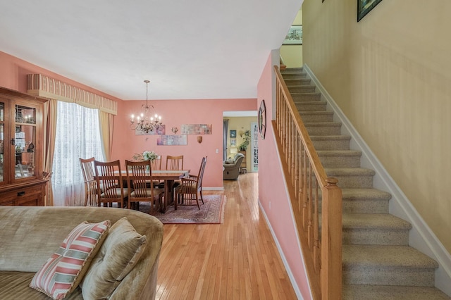 dining space featuring a chandelier and hardwood / wood-style flooring