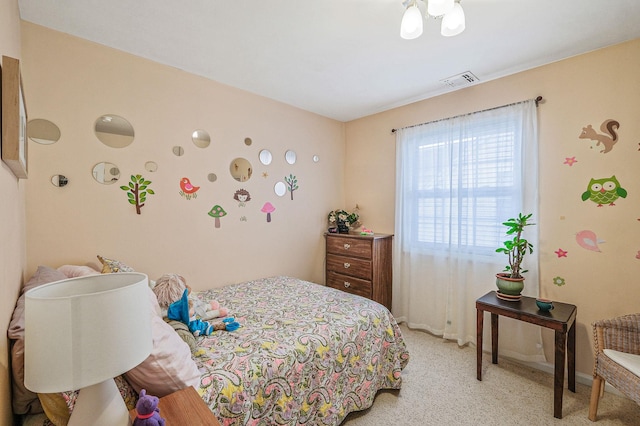 bedroom with light colored carpet