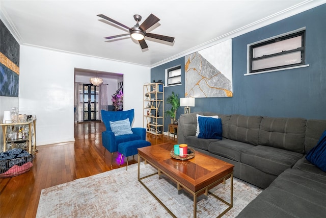 living room with ceiling fan, wood-type flooring, and crown molding