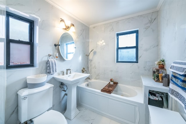 bathroom featuring toilet, crown molding, and a tub to relax in