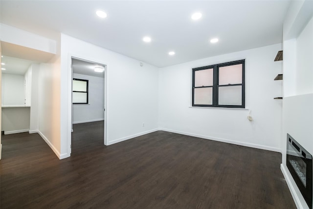 empty room featuring dark wood-type flooring