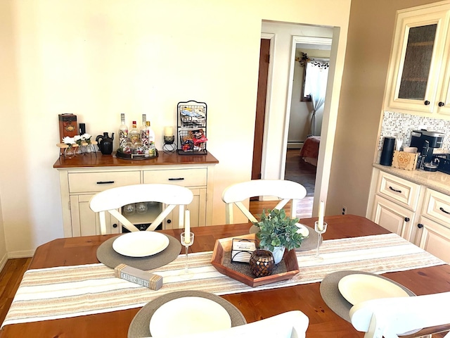 interior space featuring a baseboard radiator and wood finished floors