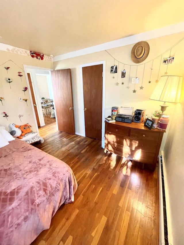 bedroom with wood finished floors