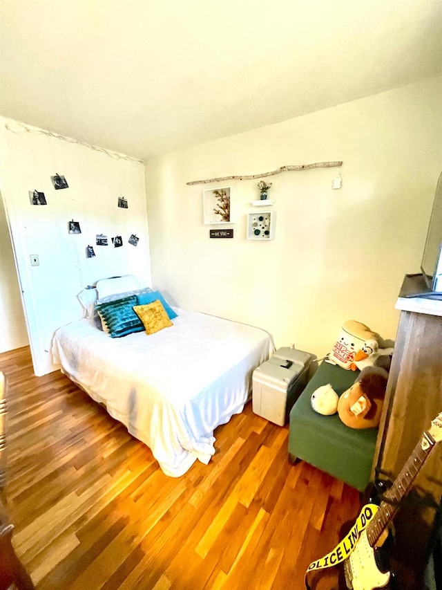 bedroom featuring wood finished floors