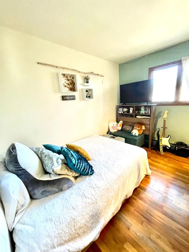 bedroom featuring hardwood / wood-style flooring