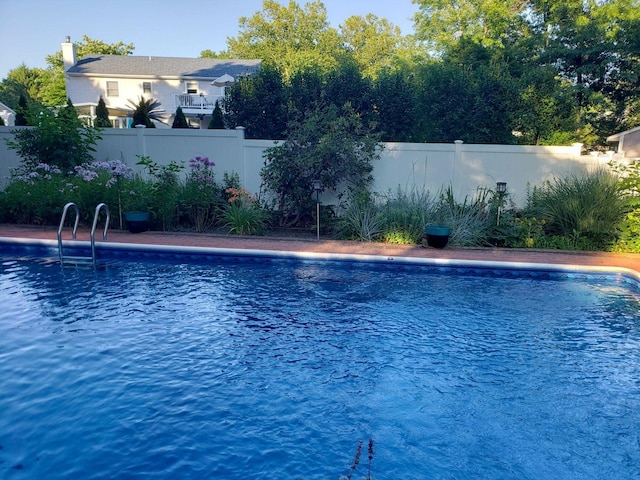 view of pool featuring a fenced backyard and a fenced in pool