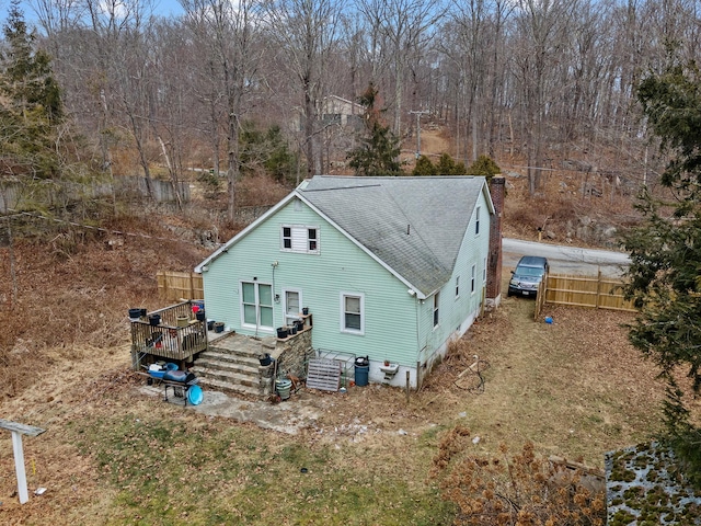 rear view of house featuring a deck