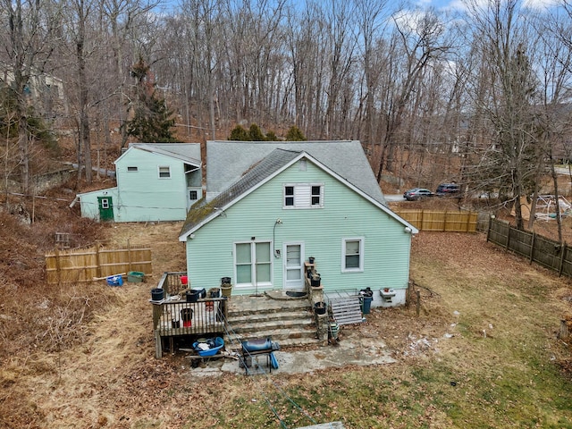 rear view of property with a deck