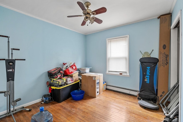 miscellaneous room with baseboard heating, ceiling fan, ornamental molding, and light hardwood / wood-style flooring