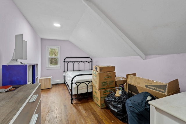 bedroom featuring lofted ceiling with beams and wood-type flooring