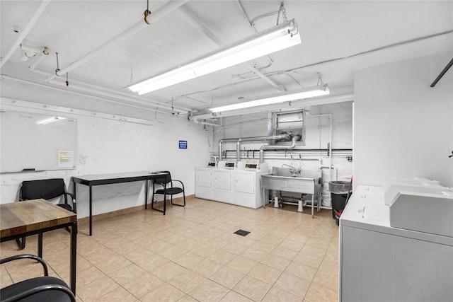 laundry room with sink and washer and clothes dryer