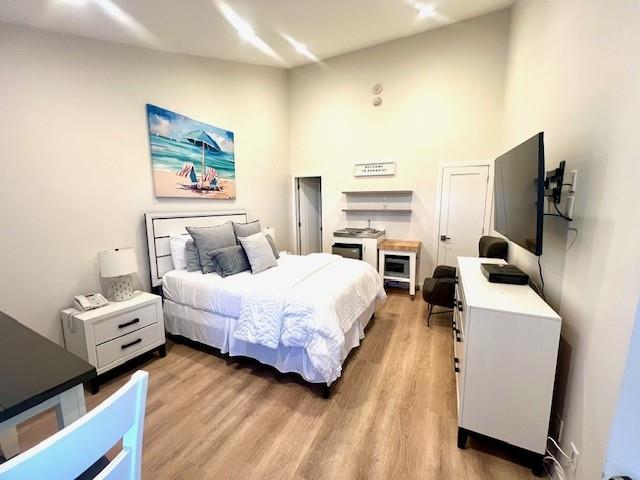 bedroom with light wood-type flooring