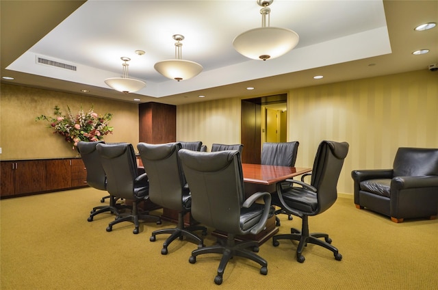 carpeted office with a raised ceiling