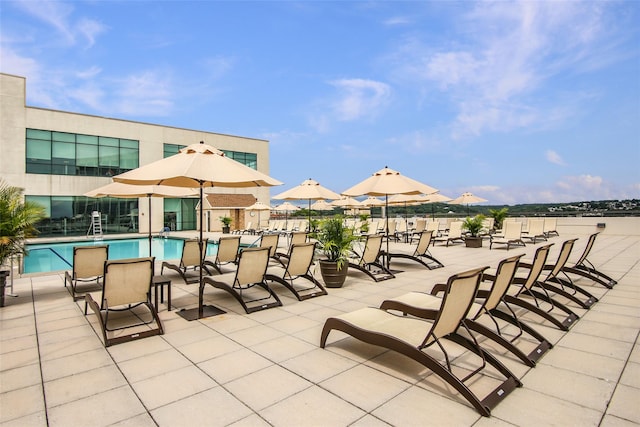 view of patio with a community pool