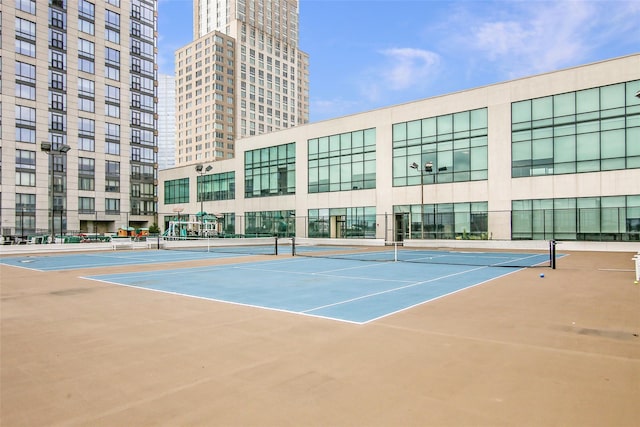 view of sport court with basketball hoop