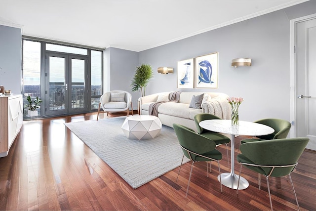 living room with expansive windows, ornamental molding, wood-type flooring, and french doors