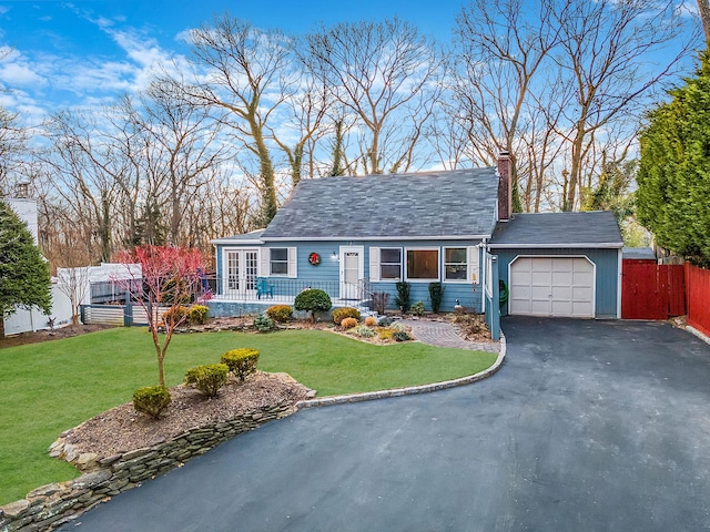 single story home with a front lawn and a garage