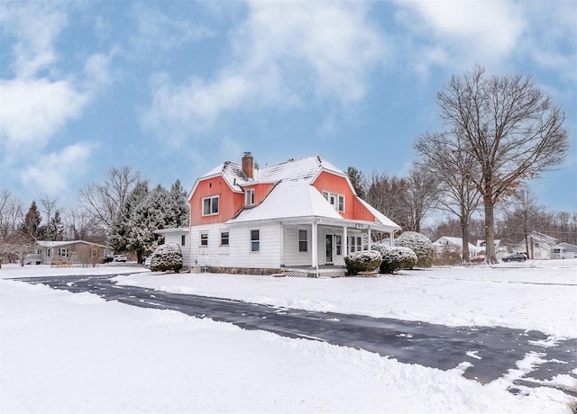 view of snow covered property