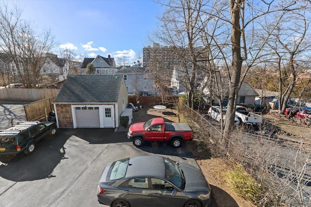 exterior space featuring a garage and an outdoor structure