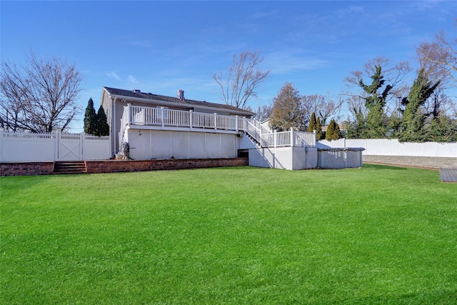 back of house with a lawn and a pool side deck