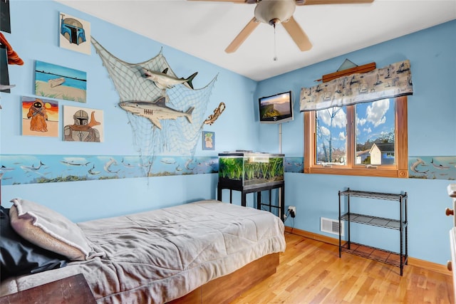 bedroom featuring ceiling fan and hardwood / wood-style floors