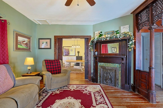 living room featuring hardwood / wood-style floors and ceiling fan