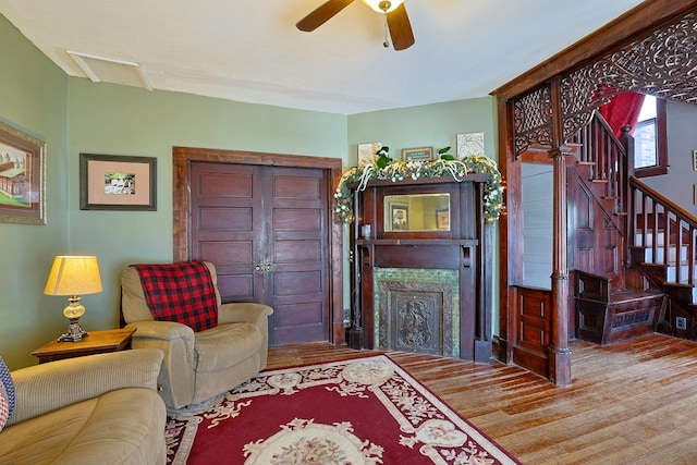 living room with ceiling fan and light hardwood / wood-style floors