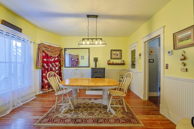 dining space featuring wood-type flooring