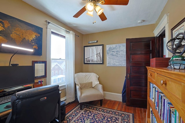 home office featuring ceiling fan, dark wood-type flooring, and plenty of natural light