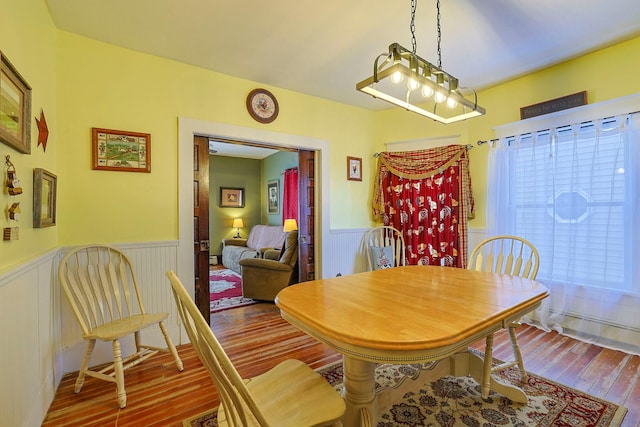 dining area with hardwood / wood-style flooring