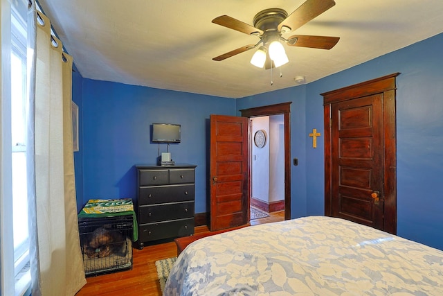 bedroom featuring ceiling fan and wood-type flooring