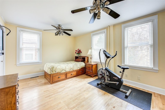 bedroom with ceiling fan and light wood-type flooring