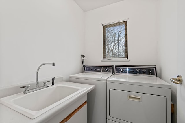 laundry room featuring sink and washer and clothes dryer