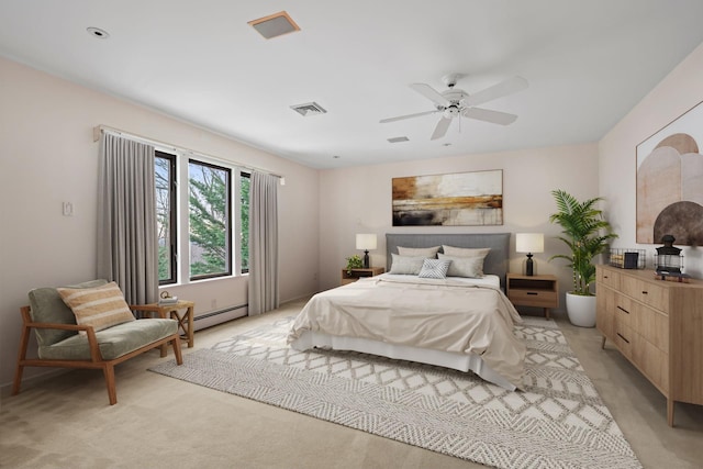 carpeted bedroom featuring ceiling fan and a baseboard radiator