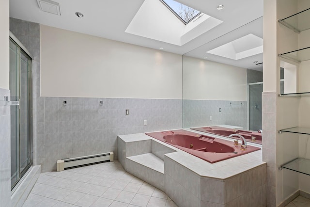 bathroom with a skylight, tile patterned flooring, and a baseboard heating unit