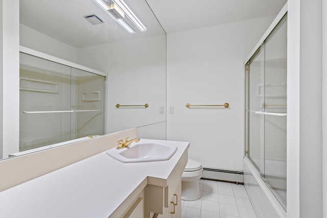 full bathroom featuring toilet, shower / bath combination with glass door, a baseboard heating unit, tile patterned floors, and vanity