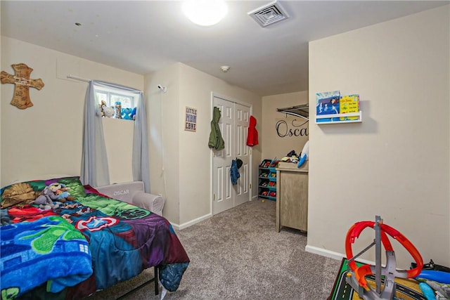 carpeted bedroom featuring a closet