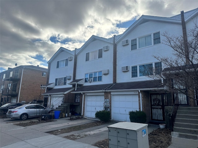 townhome / multi-family property featuring a garage