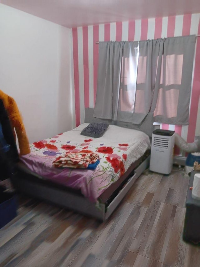 bedroom featuring hardwood / wood-style flooring