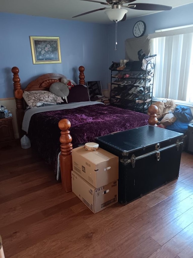 bedroom featuring hardwood / wood-style floors and ceiling fan