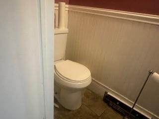 bathroom featuring tile patterned floors and toilet