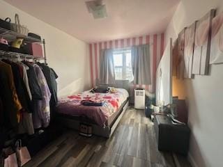 bedroom featuring wood-type flooring