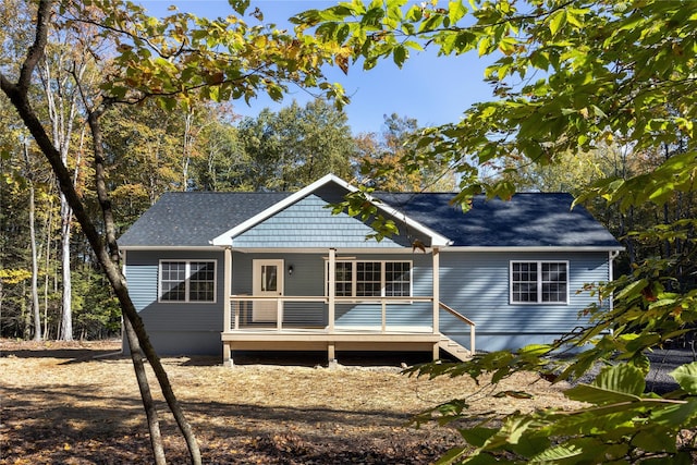 rear view of house with a wooden deck