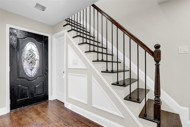 entrance foyer with dark hardwood / wood-style flooring