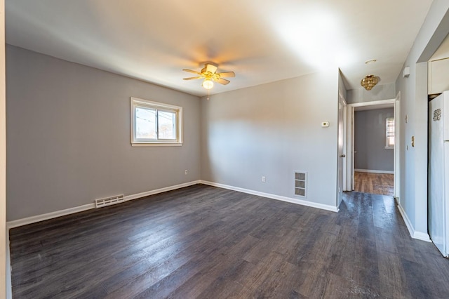 spare room featuring ceiling fan and dark hardwood / wood-style flooring