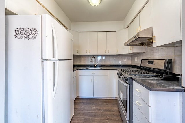 kitchen with white fridge, white cabinets, stainless steel gas range oven, and sink