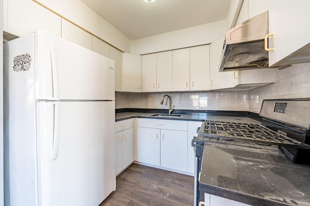 kitchen with white refrigerator, sink, white cabinets, gas stove, and dark hardwood / wood-style flooring