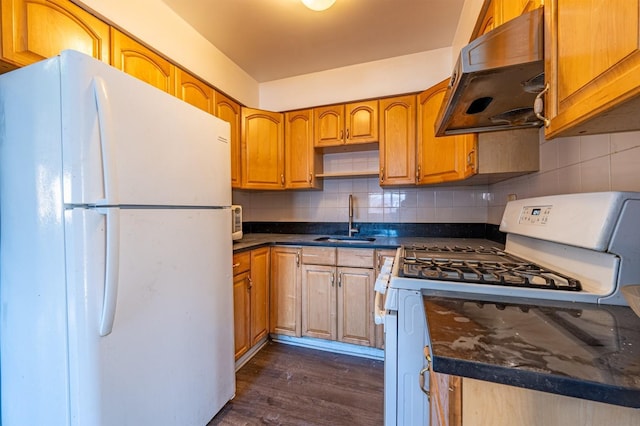 kitchen with sink, white appliances, backsplash, and dark wood-type flooring