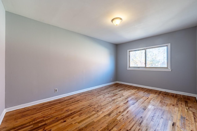 unfurnished room with light wood-type flooring